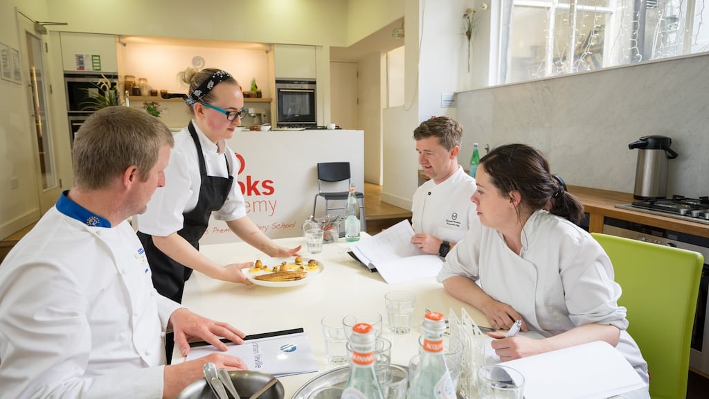 Bronagh Rogers, who has made it to the final six in the Euro-Toques Young Chef of the Year competition, presenting her semi-final dish to judges Graham Neville, Gareth Mullins and Danni Barry