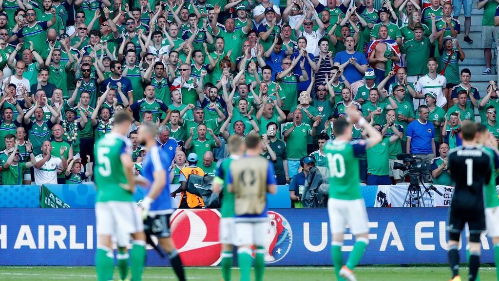 Northern Ireland fans applaud the players after the game. Photograph: Eddie Keogh/Reuters