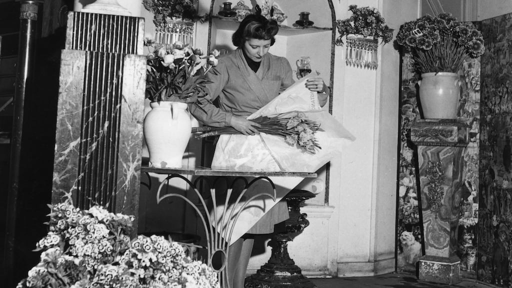 Constance Spry wraps a bouquet in her flower shop, June 1947. Photograph: George Konig/Hulton Archive/Getty