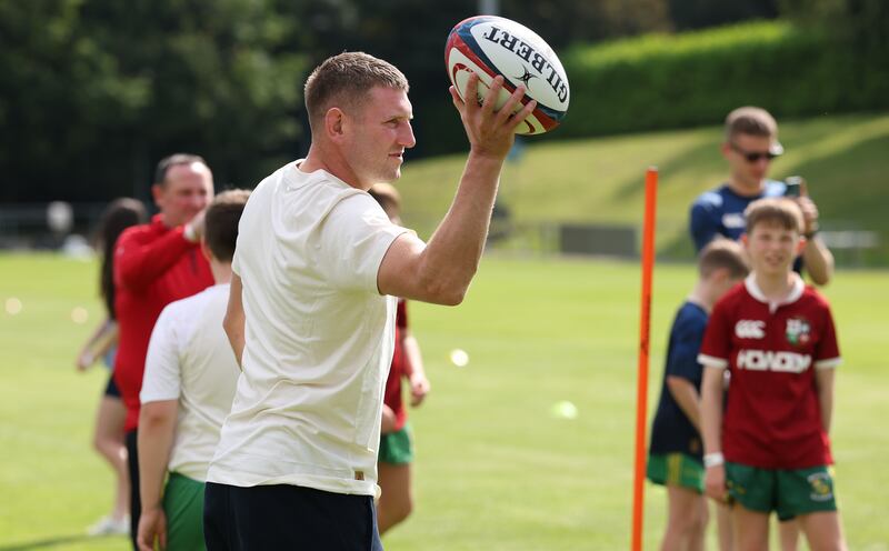 Finn Russell passes the ball during the British & Irish Lions community session held in UCD. Photograph: David Rogers/Getty