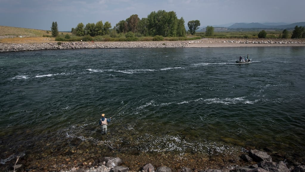 People fishing in the Snake River in Jackson Hole, Wyoming.  Photograph: David Paul Morris/Bloomberg