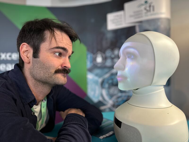Matthew Nicholson, a researcher at Trinity’s Adapt centre, showcasing Swedish company Furhat’s social robot. Photograph: Conor Capplis