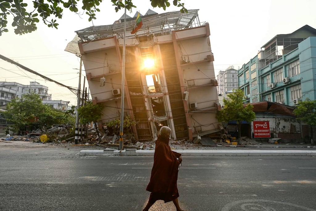 A monk walks past a collapsed building in Mandalay on Tuesday, in the wake of the earthquake that struck Myanmar last Friday. Photograph: Sai Aung Main/AFP via Getty Images