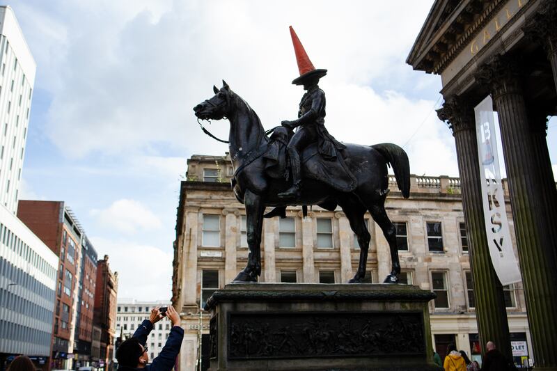 The Duke of Wellington statue crowned with a traffic cone outside the Gallery of Modern Art in Glasgow. Photograph: Emily Macinnes/Bloomberg via Getty Images