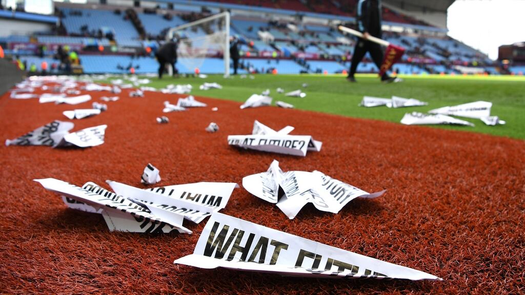 Protest banners scattered on the pitch after the Barclays Premier League match between Aston Villa and Chelsea at Villa Park. Photograph: Shaun Botterill/Getty Images