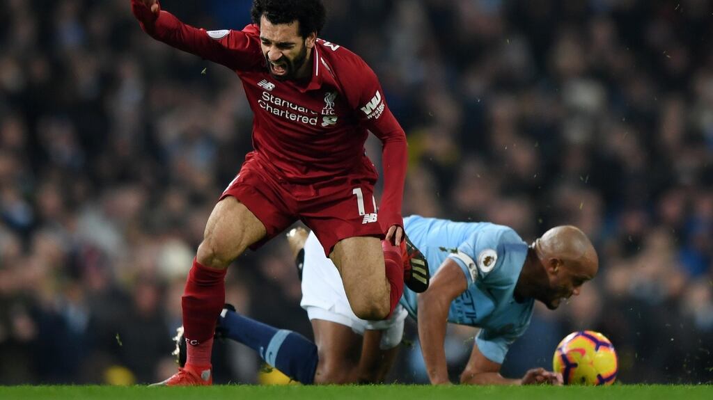 Vincent Kompany has defended his challenge on Mohamed Salah in Manchester City’s win over Liverpool. Photograph: Shaun Botterill/Getty