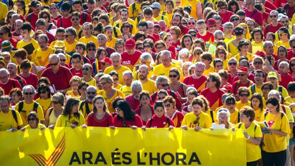 With an eye to Scotland – Barcelona, September 11th : Demonstrators march during a pro-independence demonstration as part of the celebrations of the National Day of Catalonia behind a banner rthat says in Catalan “Now is the Hour”. (Photo by David Ramos/Getty Images)