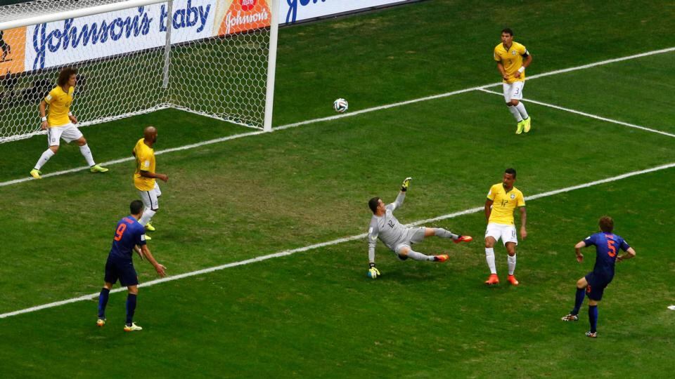 Daley Blind of the Netherlands scores past Brazil’s goalkeeper Julio Cesarat the Brasilia National Stadium. Photograph: Ruben Sprich / Reuters