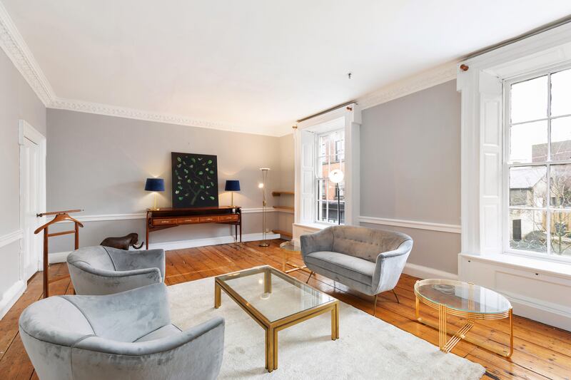 Extending to 121sq m (1,302sq ft) over two floors, the apartment retains period details such as open fireplaces, high ceilings, detailed cornicing and polished pine floors.