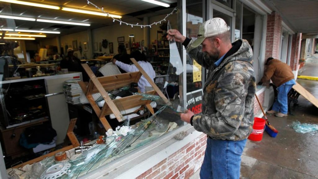 Brandon Smith removes broken glass from the West Thrift Shop in the town of West, near Waco, Texas. Photograph: Mike Stone/Reuters