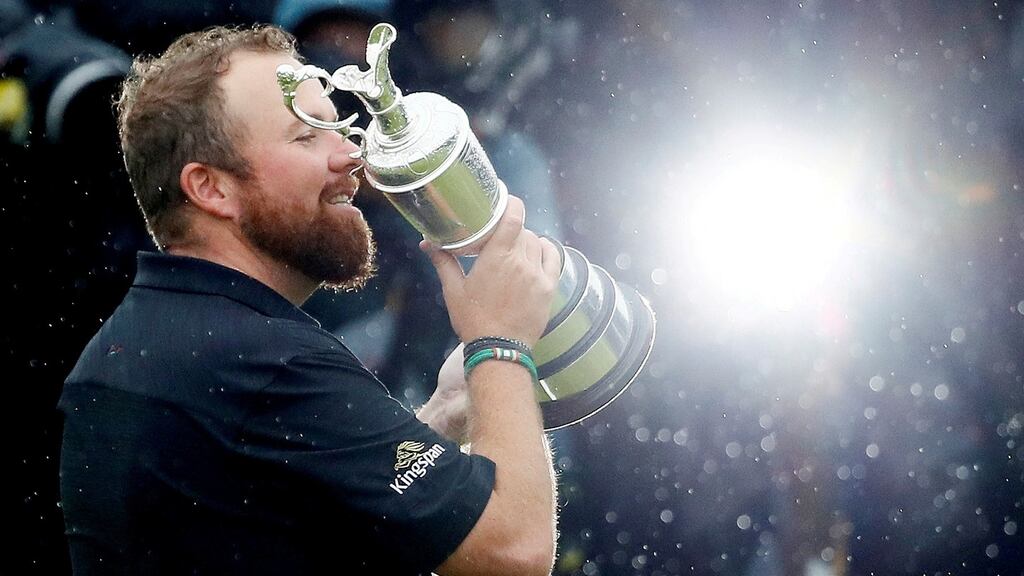 Shane Lowry celebrates with the Claret Jug trophy after winning the 2019 Open Championship at Royal Portrush. Photograph: Jason Cairnduff/Reuters
