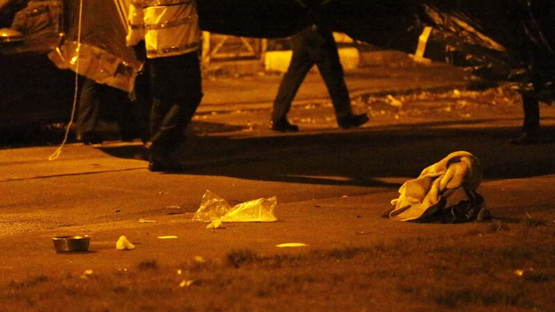 Items are seen on the ground near where David Douglas was shot and wounded on Killala Road, in Dublin 7 on Sunday evening. Photograph: Collins