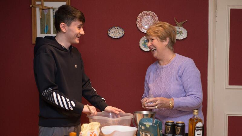 Ann Fleming and her eldest grandchild Cian Domican, making Christmas pudding. Photograph: Dave Meehan