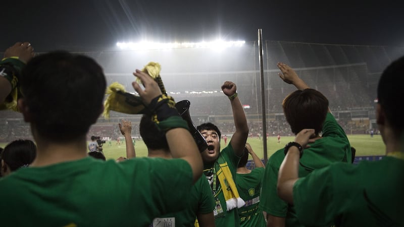 Ultra supporters of Beijing Guoan. Photograph: Kevin Frayer/Getty Images