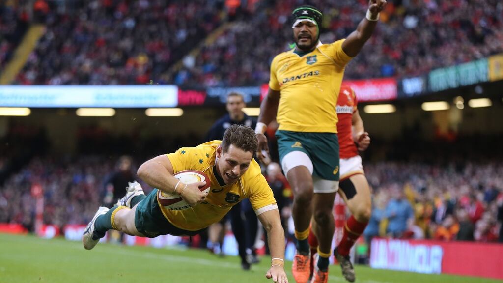 Bernard Foley of Australia dives over to score his team’sfourth try during the international match between Wales and Australia at the Principality Stadium in Cardiff, Wales. Photo: David Rogers/Getty Images