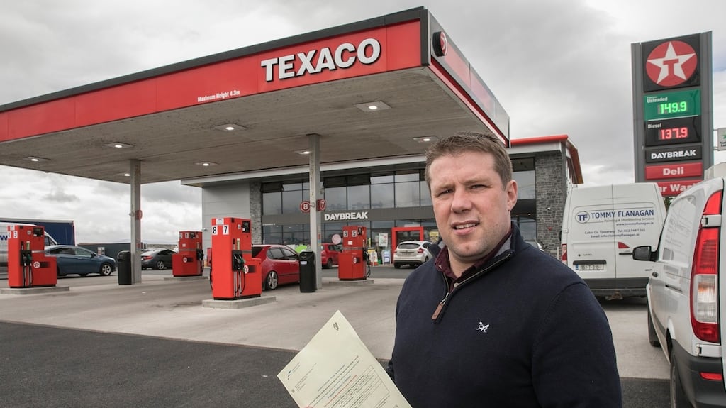 Alan O’Donnell at Woodview service station in Cahir, Co Tipperary, with his rates bill. Photograph: John D Kelly