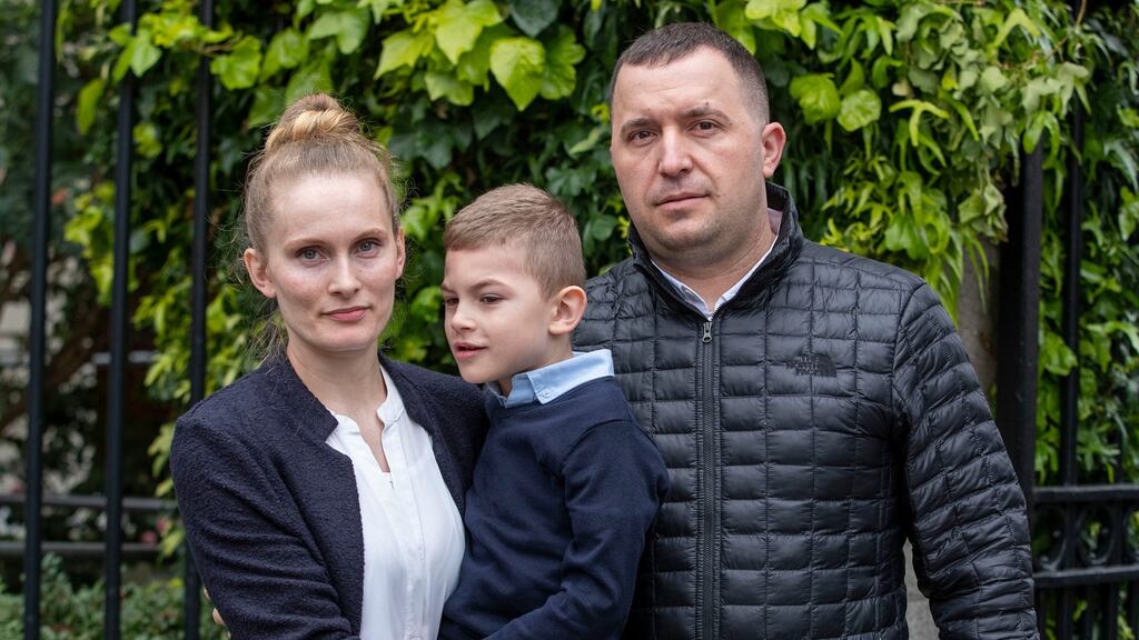 Loredana and Silviu Dediu with their son Adam (5) outside the Four Courts on Tuesday. Photograph: Collins Courts