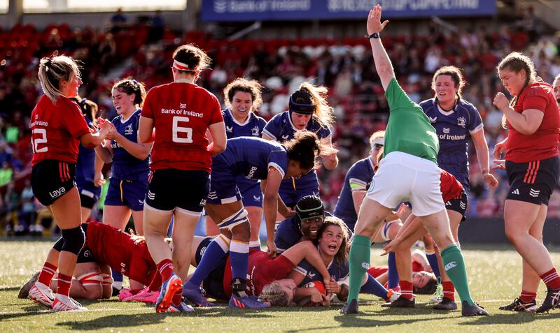 Leinster’s Leah Tarpey celebrates scoring a try with Linda Djougang during the victory over Munster at Musgrave Park. Photograph: James Crombie/Inpho