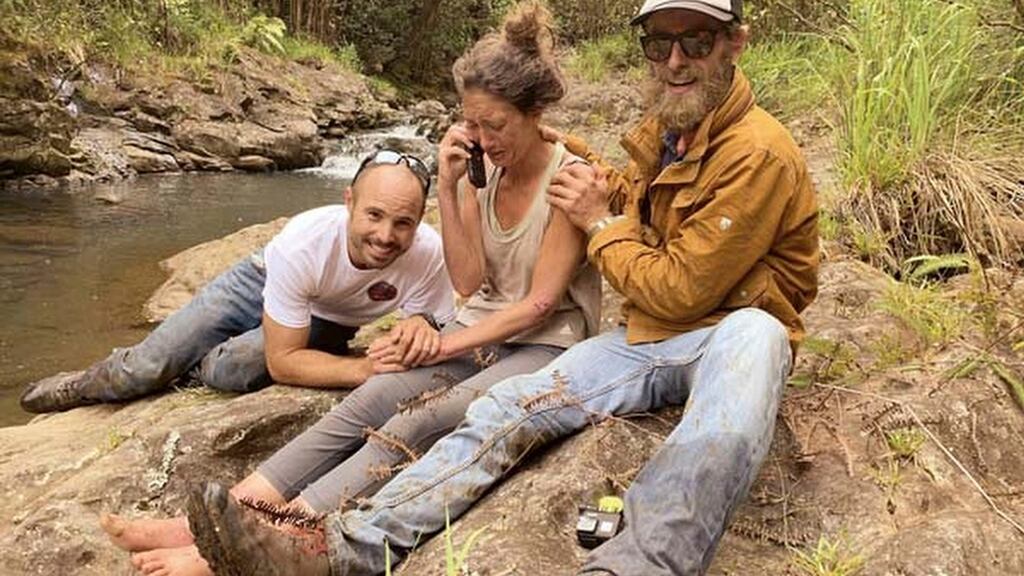Amanda Eller, second from left, after being found by searchers, Javier Cantellops, far left, and Chris Berquist, right, above the Kailua reservoir in East Maui, Hawaii/ Photograph: Troy Jeffrey Helmer/Find Amanda via AP