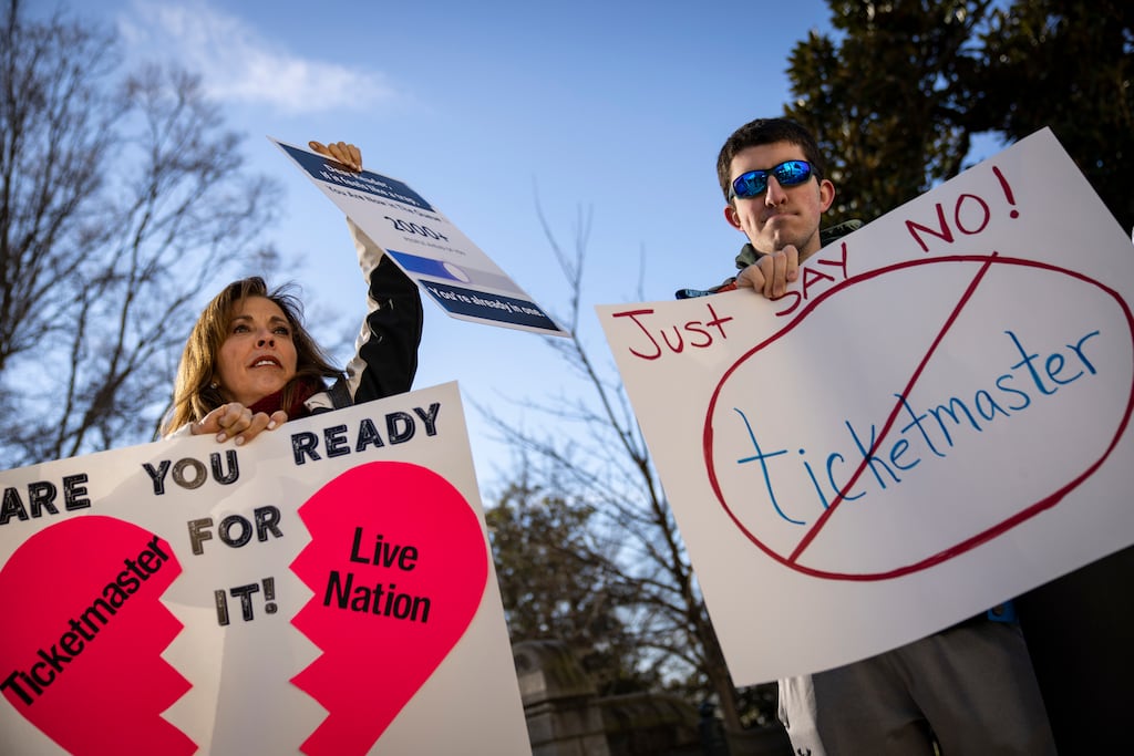 Penny Harrison and her son Parker Harrison rally against the live entertainment ticket industry outside the US Capitol in Washington, DC, on Tuesday. Photograph: Drew Angerer/Getty Images