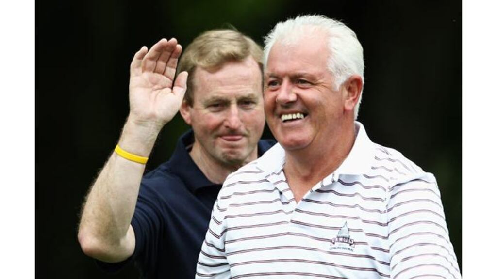 Gerry McIlroy (right) is congratulated by Taoiseach Enda Kenny on the 15th hole during the Pro Am prior to the Open held at Killarney Golf and Fishing Club on July 27th, 2011. - (Photograph: Dean Mouhtaropoulos/Getty Images)
