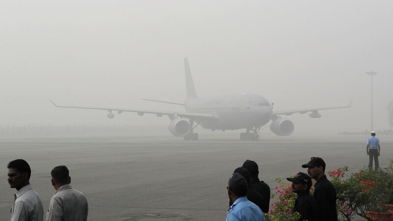 A Royal Air Force aircraft carrying UK Prince Charles and his wife Camilla, Duchess of Cornwall, arrives enveloped in smog in New Delhi, India on Wednesday. Photograph: Manish Swarup/PA