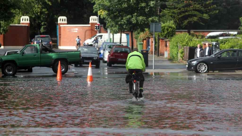 Flood waters on Jones Road beside Croke Park in Dublin yesterday after torrential rain fell over Dublin city causing on-the-spot flooding. Photograph: Sam Boal/Photocall Ireland