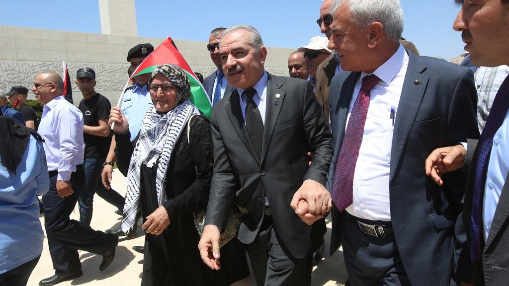 Prime minister Mohammad Shtayyeh (centre) told his cabinet that Palestinians “do not trade our national rights for money”. Photograph: Alaa Badarneh/EPA