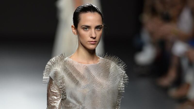 A flirty future: Designer Ying Gao has created a collection of dresses that flutter when someone glances at them. Tiny motors in the fibres of the dress move in patterns when eye tracking technology can sense a lingering gaze. In a matter of years our clothing will be doing the flirting for us. Photograph: Gerard Julien/AFP/Getty Images