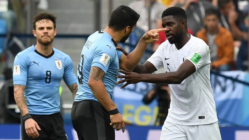 Luis Suarez argues with Samuel Umtiti. Photo: Martin Berneti/Getty Images