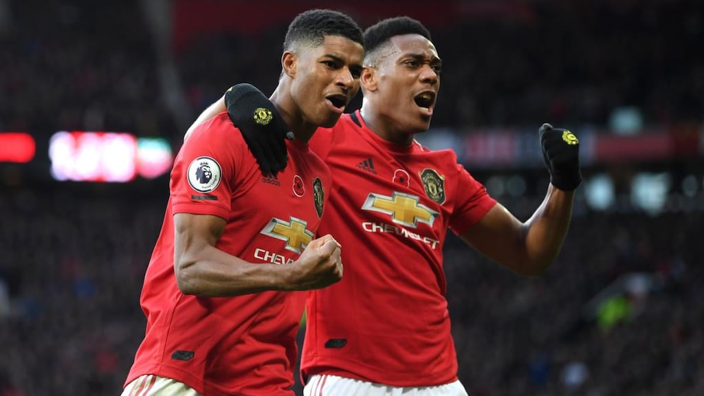 Marcus Rashford celebrates his goal against Brighton with Anthony Martial. Photograph: Michael Regan/Getty