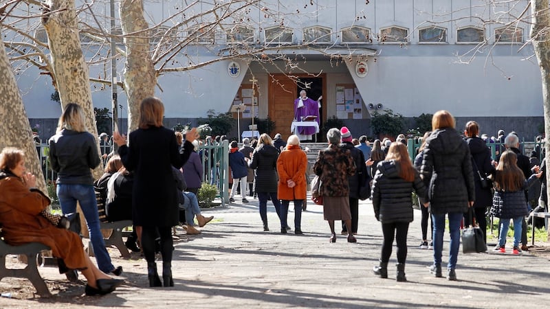 A priest celebrates Mass in the open air, after Italy's bishops ordered Masses not be held in churches in order to contain the coronavirus outbreak, in Rome, Italy March 8, 2020. REUTERS/Remo Casilli