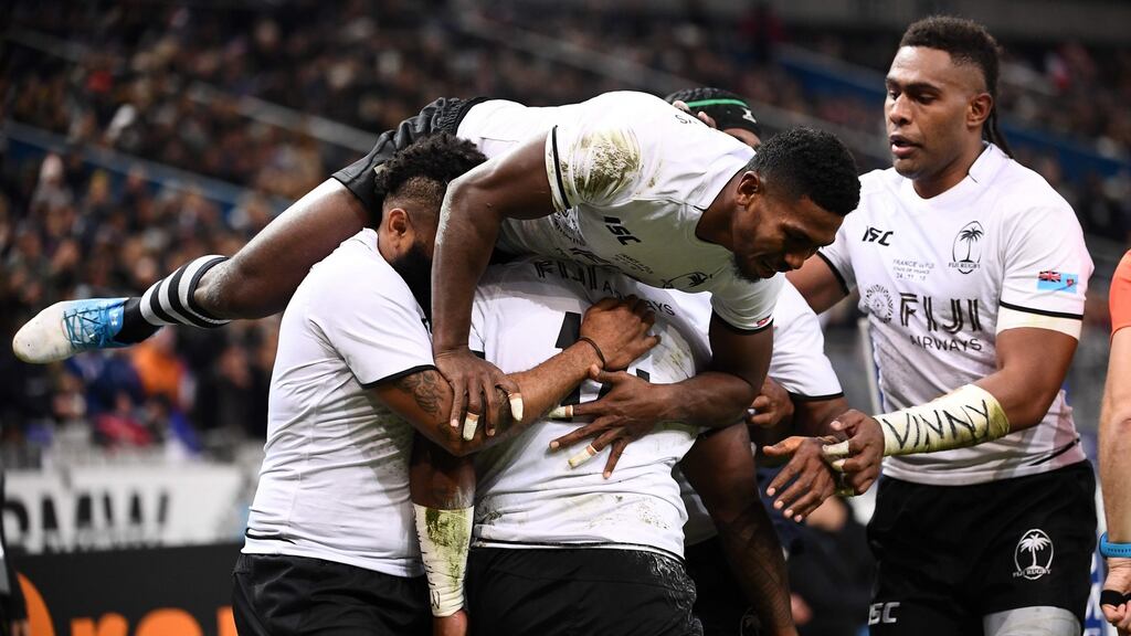 Fiji’s right wing Josua Tuisova (hidden) celebrates with team-mates after scoring a try during the autumn international against France at the Stade de France. Photograph: Anne-Christine Poujoulat/AFP/Getty Images