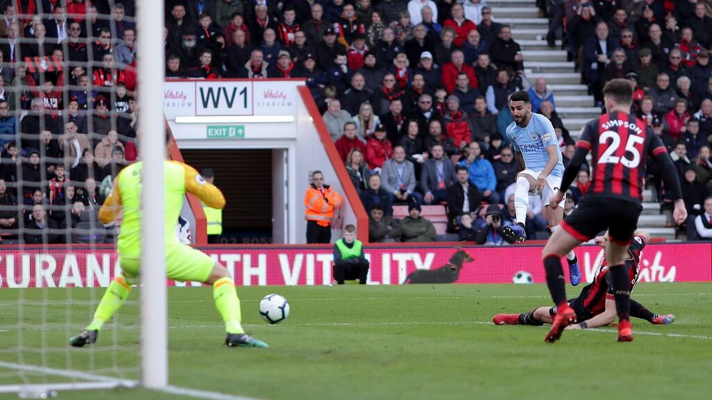 Riyad Mahrez of Manchester City scores past Artur Boruc of Bournemouth. Photograph: Richard Heathcote/Getty Images