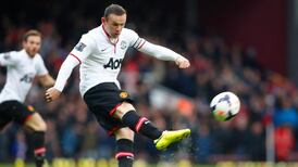 Rooney wonder goal lifts spirits of toiling champions