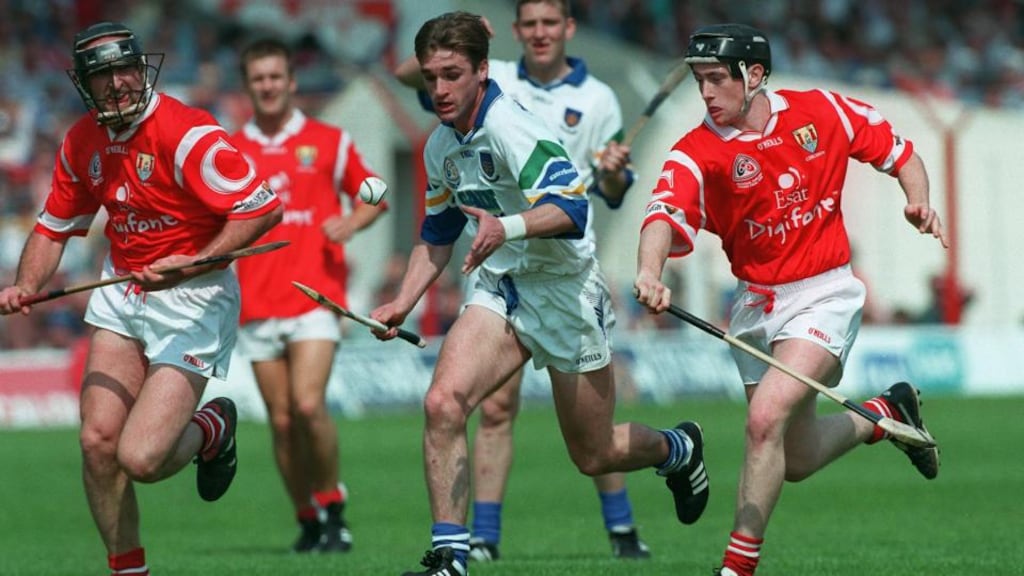 Waterford’s Tony Browne is pursued by Brian Corcoran and Pat Ryan of Cork during the 1998 National Hurling League Final. Photograph: Patrick Bolger/Inpho.