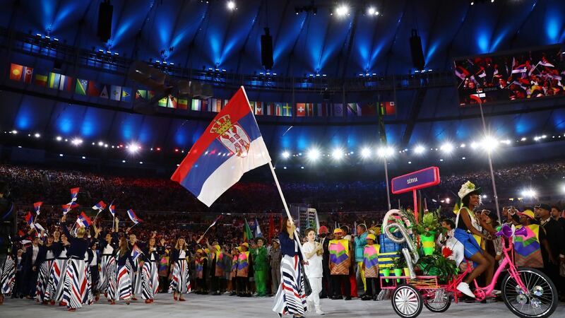 The Serbian atheles complete with skirts that ‘would play havoc with your telly’s horizontal hold’ during the opening ceremong parade Photograph: Kai Pfaffenbach/Reuters