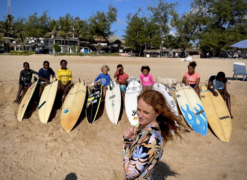Grace Doyle with her young charges before getting into the surf at Tofo Beach.