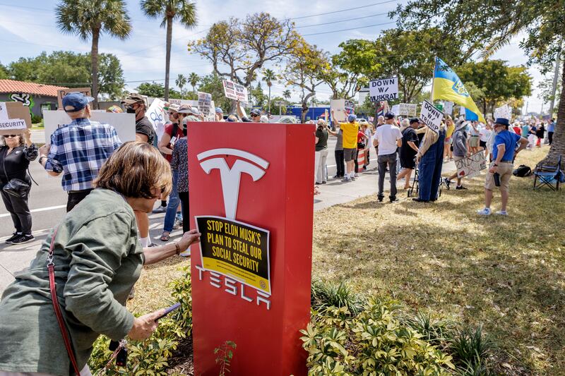 Activists attend a 'Tesla Takedown' protest in front of a Tesla showroom in Florida on March 22nd. Photograph: EPA-EFE
