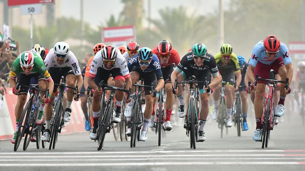 Italian Elia Viviani of DeceuninckQuick-Step team (second) sprints to win ahead of Colombian Fernando Gaviria of UAE Team during the fifth stage of the UAE tour in Khor Fakkan. Photograph:  Giuseppe Cacace/AFP/Getty Images