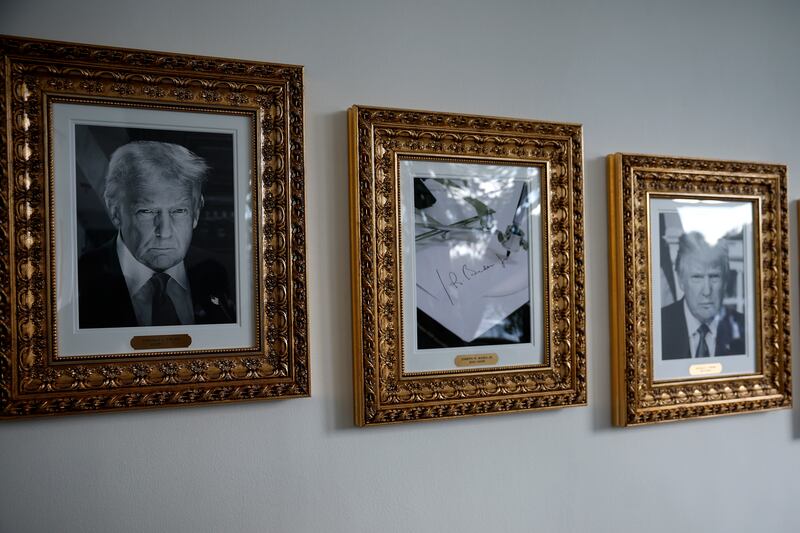 Framed portraits of US president Donald Trump flank an image of former US president Joe Biden's signature along the presidential walk of fame at the White House. Photograph: Kevin Dietsch/Getty Images