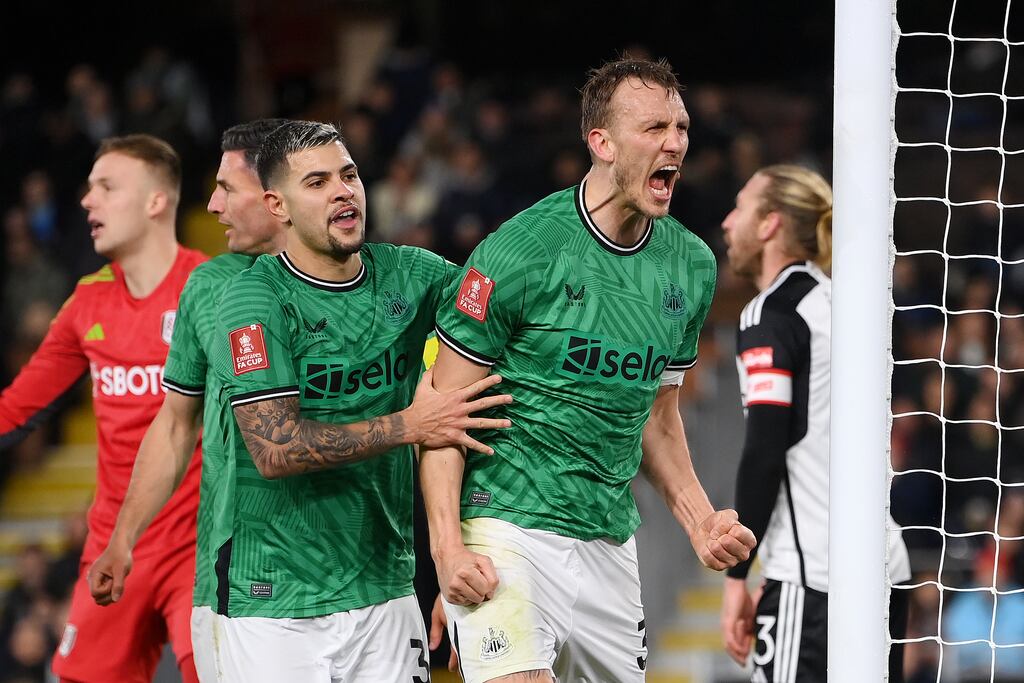 Dan Burn of Newcastle United celebrates scoring vs Fulham in the FA Cup. Photograph: Mike Hewitt/Getty Images