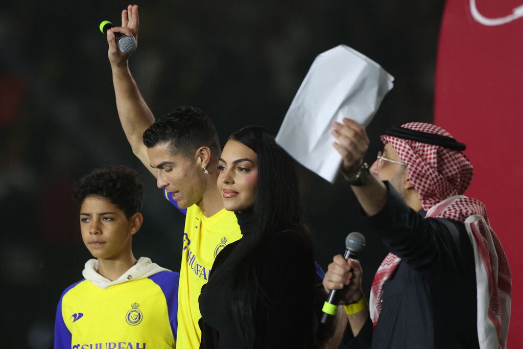 Cristiano Ronaldo, with his partner Georgina Rodriguez and his son Cristiano Ronaldo Jr, during the unveiling ceremony at the Mrsool Park Stadium. Photograph: Getty Images