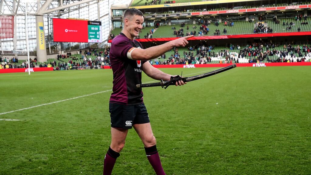 Johnny Sexton celebrates after being presented with a ceremonial sword from the Japan team after winning his 100th cap. Photograph: Dan Sheridan/Inpho