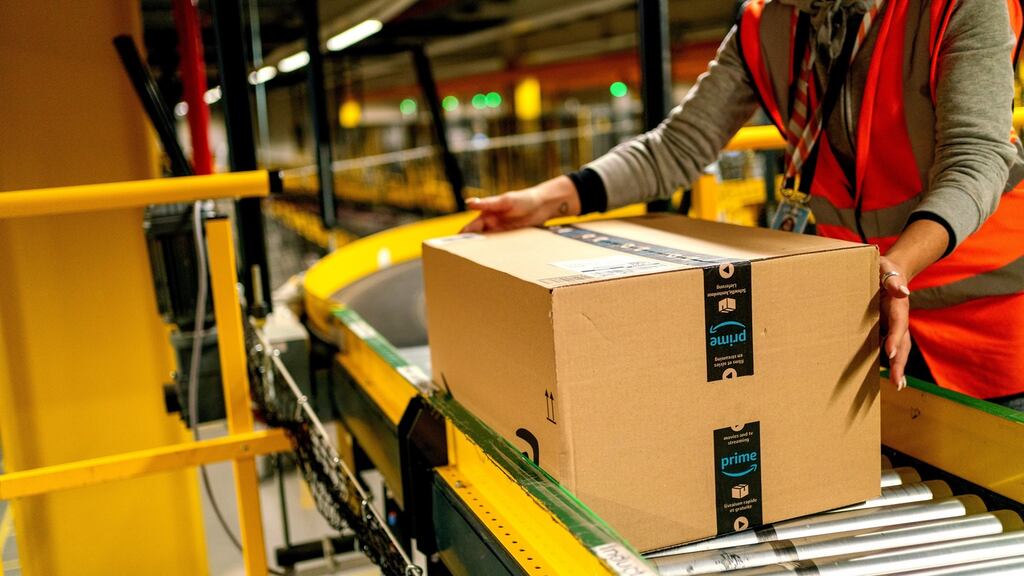 A worker collects an Amazon Prime customer order package: Unions are one obvious and historically powerful way to unite and tackle large-scale worker grievances. Photograph: Thorsten Wagner/Bloomberg