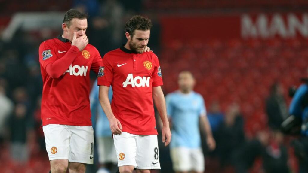Manchester United’s Wayne Rooney and Juan Mata (right) during the 3-0 defeat to  Manchester City on Tuesday. Photograph:  Peter Byrne/PA Wire
