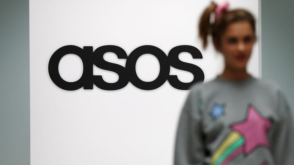 A model walks on an in-house catwalk at Asos. Photograph: Suzanne Plunkett/Reuters
