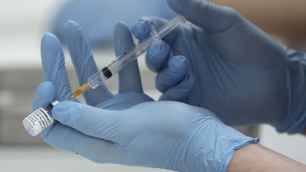 A healthcare worker uses a syringe to dilute the Pfizer-BioNTech Covid-19 vaccine. File photograph: Kiyoshi Ota/Bloomberg
