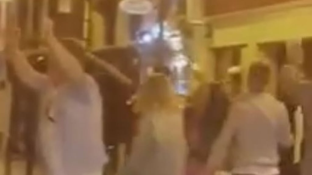 A screengrab from one of the videos that claims to show a group of people singing and dancing on the streets of Killarney on Saturday night.