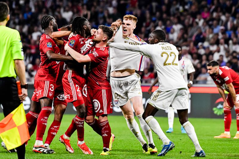 Bradley Locko of Brest (centre) fights with Jake O'brien of Lyon (R) during a Ligue 1 fixture. Photograph: Eurasia Sport Images/Getty Images